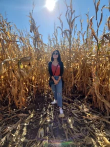 Anna posing in Iowa corn field