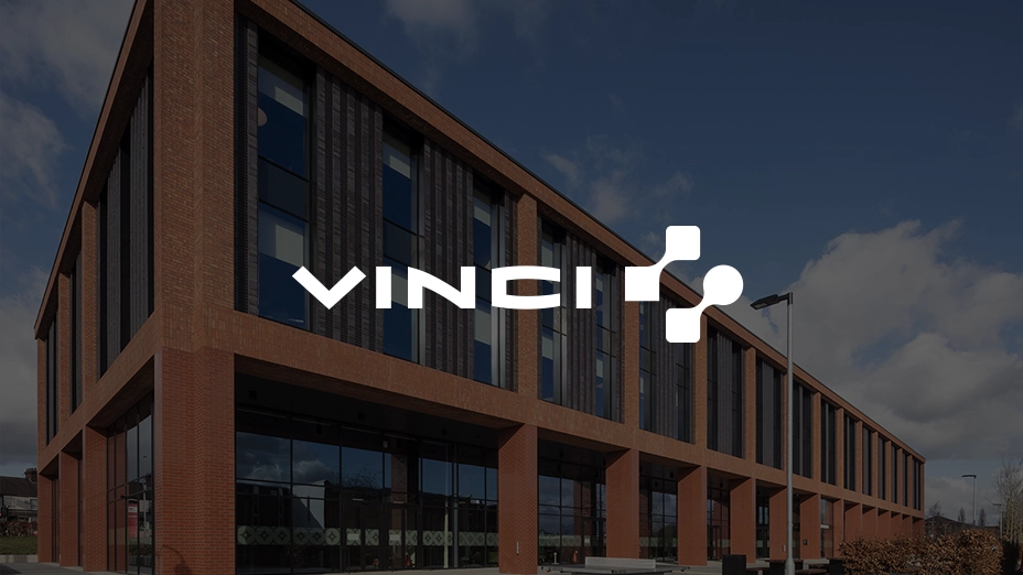 Vinci logo with building in background