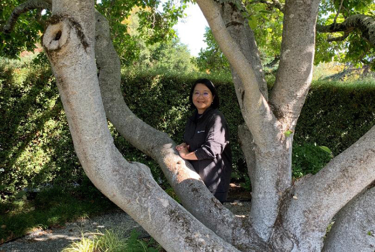 Renata Caron and a 100+ year-old magnolia tree