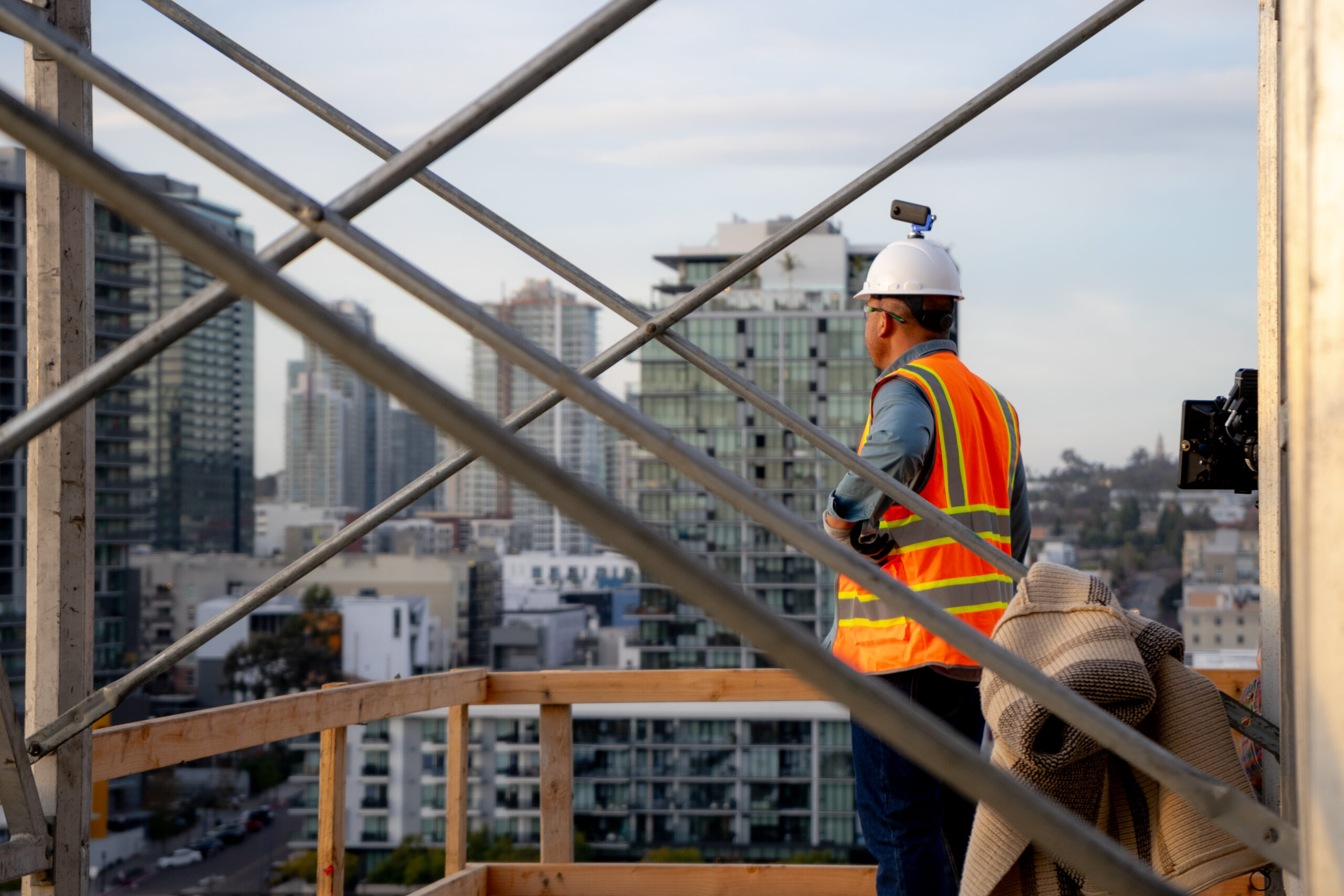 Worker Looking out from Construction Site