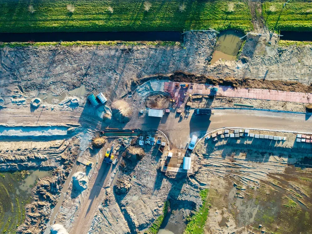 Civil construction workers at an active infrastructure project site representing reality capture for site documentation